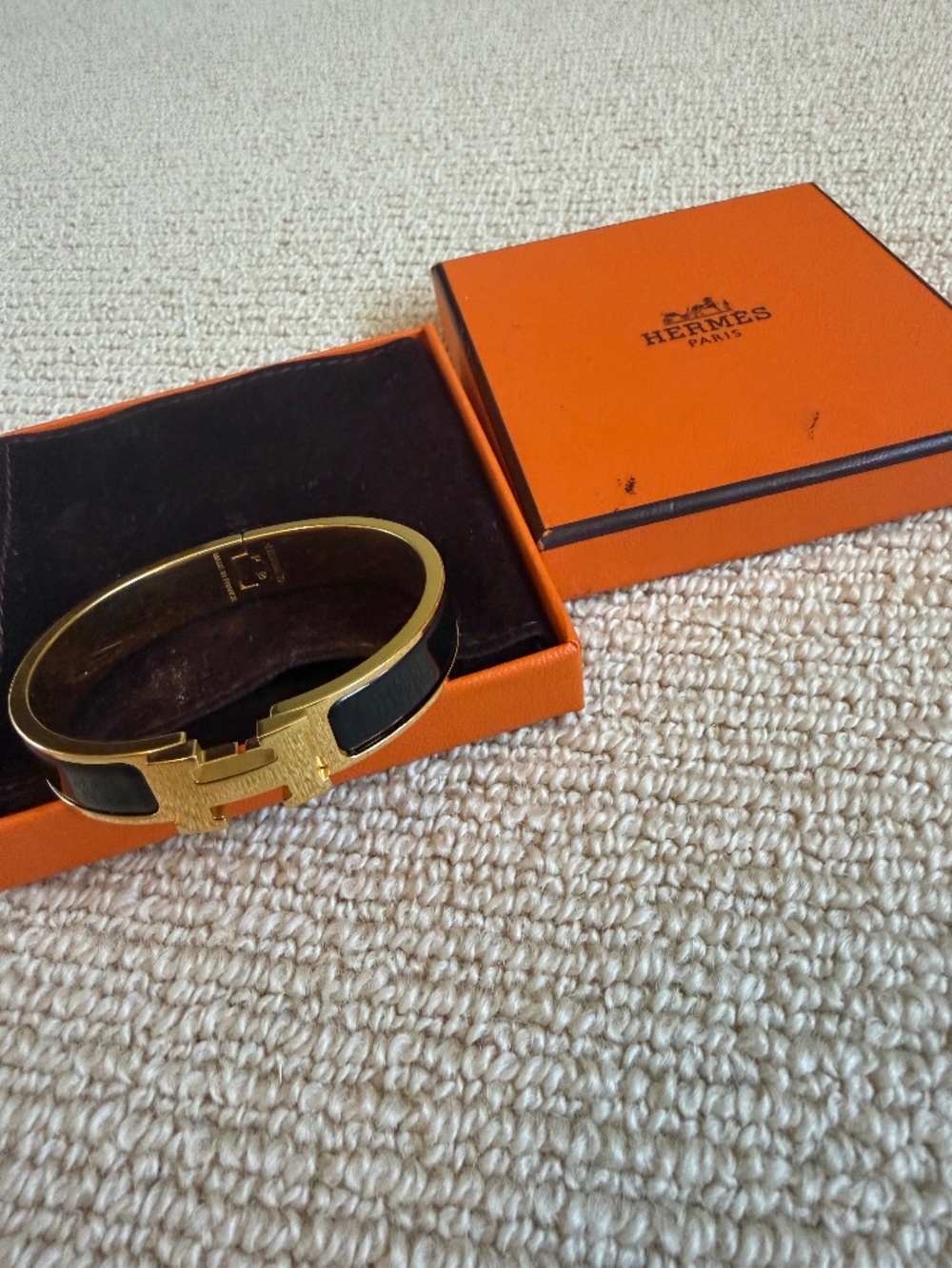 Hermès black enamel bangle with gold H logo